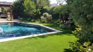 Artificial Grass surrounding backyard pool