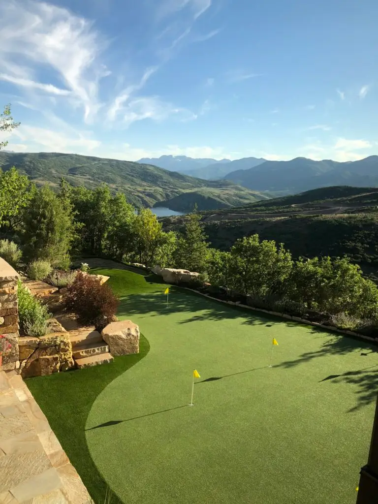 Signature mountain-estate putting green with artificial turf and panoramic views designed by Celebrity Greens®