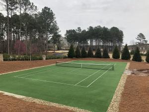 An artificial sports grass tennis court